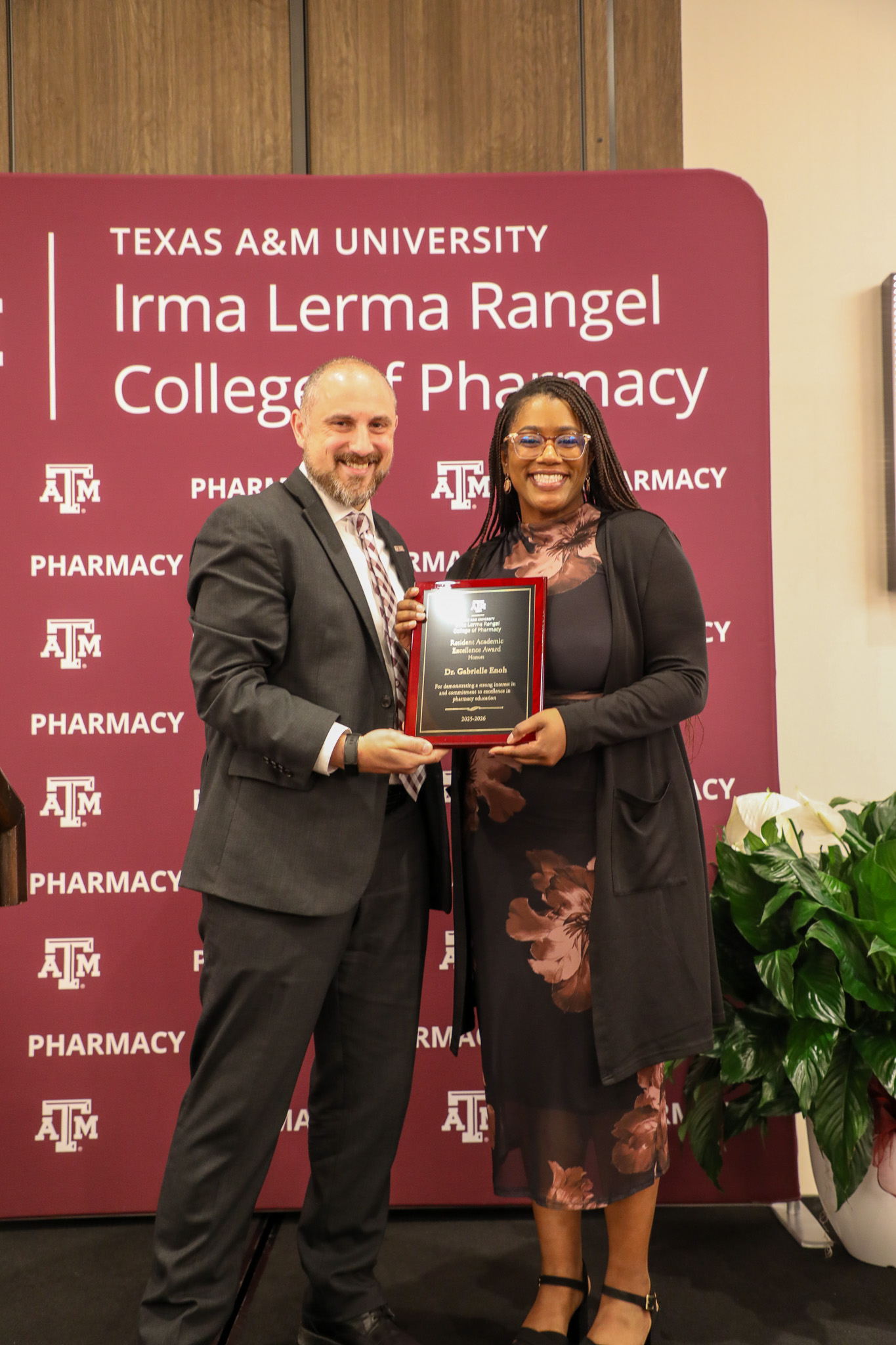Dr. Enoh receiving an award