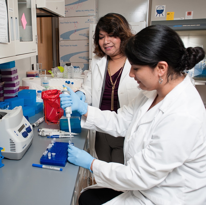 Professor and student working in a lab